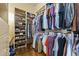 Walk-in closet with custom organization, shelving, and clothing racks at 13249 E Summit Dr, Scottsdale, AZ 85259