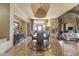 Elegant dining room with chandelier, tray ceiling, and access to outdoor space, perfect for entertaining at 13249 E Summit Dr, Scottsdale, AZ 85259
