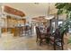 Open concept floor plan with a dining table, chairs, and stylish chandelier at 13249 E Summit Dr, Scottsdale, AZ 85259