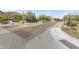 Desert community entrance with stone monuments, iron gates, mature landscaping, and mountain views at 13249 E Summit Dr, Scottsdale, AZ 85259