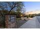 Exterior of home featuring desert landscaping, address marker, and stone accents at 13249 E Summit Dr, Scottsdale, AZ 85259