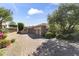 Attractive home with a brick driveway, mature trees, and manicured landscaping at 13249 E Summit Dr, Scottsdale, AZ 85259