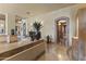 Grand foyer boasts decorative accents, stone floors, and arched doorways, creating a welcoming entrance at 13249 E Summit Dr, Scottsdale, AZ 85259
