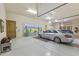 Spacious garage with ample storage, a unique mural, and room for multiple vehicles at 13249 E Summit Dr, Scottsdale, AZ 85259