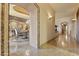 Hallway view that includes dining area with chandelier and fireplace at 13249 E Summit Dr, Scottsdale, AZ 85259