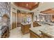 Gourmet kitchen featuring custom wood cabinets, granite countertops, and a large central island at 13249 E Summit Dr, Scottsdale, AZ 85259