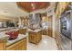 Gourmet kitchen with stone accents, tile floor, and custom wood cabinetry at 13249 E Summit Dr, Scottsdale, AZ 85259