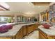 Spacious kitchen features custom cabinetry, granite countertops, and seamless access to the patio at 13249 E Summit Dr, Scottsdale, AZ 85259