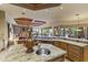 Open-concept kitchen with a granite island, stainless steel sinks, and a view of the living area at 13249 E Summit Dr, Scottsdale, AZ 85259