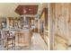 Gourmet kitchen featuring custom wood cabinetry, granite countertops, a stone backsplash, and modern stainless steel appliances at 13249 E Summit Dr, Scottsdale, AZ 85259