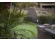 Lush landscaping and native vegetation enhancing the curb appeal of the property and blending it with nature at 13249 E Summit Dr, Scottsdale, AZ 85259