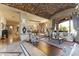 Elegant living room featuring a brick barrel ceiling, staircase, and luxurious furnishings at 13249 E Summit Dr, Scottsdale, AZ 85259