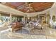 Elegant living room featuring a decorative ceiling, exposed beams and a seamless indoor-outdoor flow at 13249 E Summit Dr, Scottsdale, AZ 85259