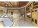 Spacious living room featuring a stone fireplace, built-in shelves, a wet bar and marble floors for added elegance at 13249 E Summit Dr, Scottsdale, AZ 85259