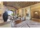 Elegant living room with a brick barrel ceiling, a fireplace, and a seamless transition to outdoor living at 13249 E Summit Dr, Scottsdale, AZ 85259