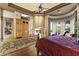 Spacious main bedroom with fireplace, hardwood floors, and backyard views at 13249 E Summit Dr, Scottsdale, AZ 85259