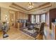 Comfortable home office space featuring custom cabinets, wood floors, and plenty of natural light at 13249 E Summit Dr, Scottsdale, AZ 85259