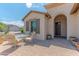 Inviting front patio area with seating, providing an ideal spot for outdoor relaxation at 15353 W Cheery Lynn Rd, Goodyear, AZ 85395