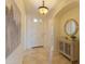 Inviting foyer with tile flooring, stylish decor, and plenty of natural light at 15353 W Cheery Lynn Rd, Goodyear, AZ 85395