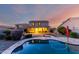 A beautiful backyard showcasing a pool, patio, and landscaping, perfect for entertaining and relaxation at 1647 W Gold Mine Way, San Tan Valley, AZ 85144