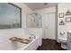 Bright bathroom features a soaking tub with shower, tile floors, and modern fixtures at 1647 W Gold Mine Way, San Tan Valley, AZ 85144