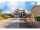 A two-story home with a garage and landscaped front yard at 1647 W Gold Mine Way, San Tan Valley, AZ 85144