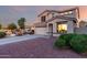 Two-story home with an attached garage and landscaping at 1647 W Gold Mine Way, San Tan Valley, AZ 85144