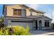 Charming two-story home with a two-car garage, desert landscaping, and neutral-toned stucco exterior at 1647 W Gold Mine Way, San Tan Valley, AZ 85144
