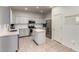 Bright kitchen features stainless steel appliances, subway tile backsplash, and a center island at 1647 W Gold Mine Way, San Tan Valley, AZ 85144