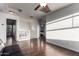 Spacious loft area with hardwood floors, white walls, and natural light creating an inviting, open space at 1647 W Gold Mine Way, San Tan Valley, AZ 85144