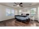 Spacious main bedroom with laminate floors, ceiling fan, and serene view at 1647 W Gold Mine Way, San Tan Valley, AZ 85144