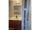 Modern bathroom with updated vanity, mirror, and shelving, showcasing a clean and functional design at 16602 N 25Th St # 123, Phoenix, AZ 85032