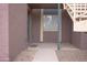 Exterior view of the front entrance with walkway and partial staircase at 16602 N 25Th St # 123, Phoenix, AZ 85032
