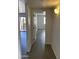 Bright hallway with neutral paint, modern floors, and doorways to other rooms at 16602 N 25Th St # 123, Phoenix, AZ 85032