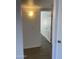 Bright hallway with neutral paint, modern floors, and doorways to other rooms at 16602 N 25Th St # 123, Phoenix, AZ 85032