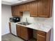 Kitchen counter and sink area with modern countertops, sink and microwave at 16602 N 25Th St # 123, Phoenix, AZ 85032