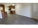 Open living space with hardwood floors flowing into the kitchen, creating a modern and inviting atmosphere at 16602 N 25Th St # 123, Phoenix, AZ 85032