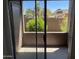 Outdoor patio with private enclosure, a shaded area, and a view of the landscaping at 16602 N 25Th St # 123, Phoenix, AZ 85032