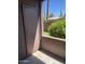 Private patio with a storage closet and a view of desert landscaping at 16602 N 25Th St # 123, Phoenix, AZ 85032