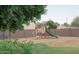 A community playground area with colorful play structures and mature landscaping at 16602 N 25Th St # 123, Phoenix, AZ 85032
