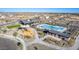 Aerial view of the community with a pool, clubhouse, playground, and walking trails at 16963 W Poinsettia Dr, Surprise, AZ 85388