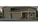 Charming single-story home with a three-car garage and covered front porch at 17812 W Luke Ave, Litchfield Park, AZ 85340