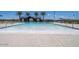 Large community pool with splash pad features, fountains and lounge chairs in a resort-style setting at 17812 W Luke Ave, Litchfield Park, AZ 85340