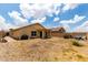 A spacious backyard featuring a patio and xeriscape landscaping, enclosed by a block wall fence at 18102 E El Viejo Desierto --, Gold Canyon, AZ 85118