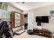 A cozy bedroom with a large window and a flat-screen TV, and dog beds, perfect for relaxation and entertainment at 18102 E El Viejo Desierto --, Gold Canyon, AZ 85118