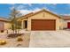Tan single-story home with a brown two-car garage and desert landscaping at 18102 E El Viejo Desierto --, Gold Canyon, AZ 85118