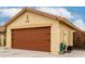 Tan home with a brown garage door and desert landscaping at 18102 E El Viejo Desierto --, Gold Canyon, AZ 85118