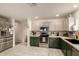 Modern kitchen with stainless steel appliances and white and dark green cabinets at 18102 E El Viejo Desierto --, Gold Canyon, AZ 85118