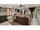 Bright living room features a brown sofa, light tile floors, and backyard access at 18102 E El Viejo Desierto --, Gold Canyon, AZ 85118