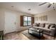 Cozy living room featuring comfortable seating, wood floors, and bright window at 18102 E El Viejo Desierto --, Gold Canyon, AZ 85118